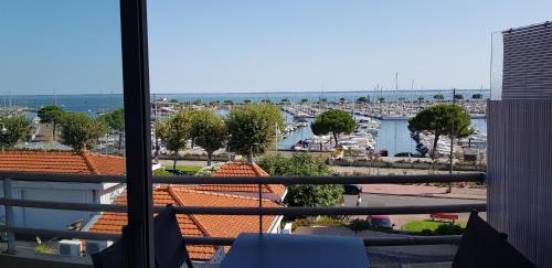a view of a marina from a balcony at ARCACHON PETIT PORT - T3 VUE BASSIN in Arcachon