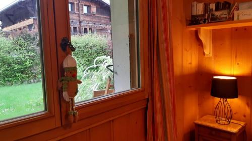 a window in a room with a view of a yard at TellaHouse in Chamonix-Mont-Blanc