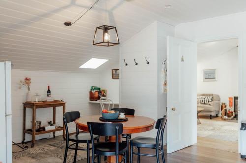 a kitchen and dining room with a table and chairs at MARYBANK ESTATE - BARN LOFT in Montacute
