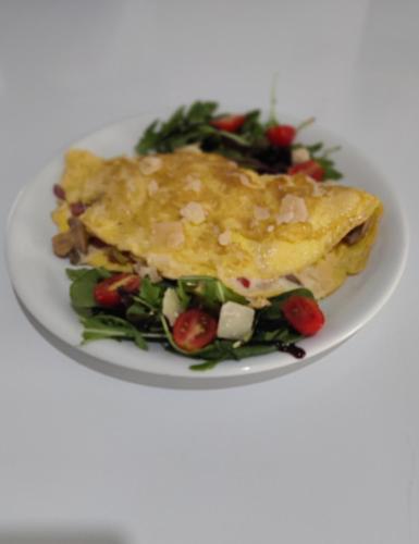 a plate of food with a salad on a white plate at Kiperi Exclusive in Parga