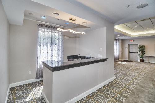 a lobby with a reception desk in a building at Holiday Inn Express Hotel & Suites Clearwater US 19 North by IHG in Clearwater