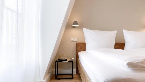 Katil atau katil-katil dalam bilik di Apartments am Dom