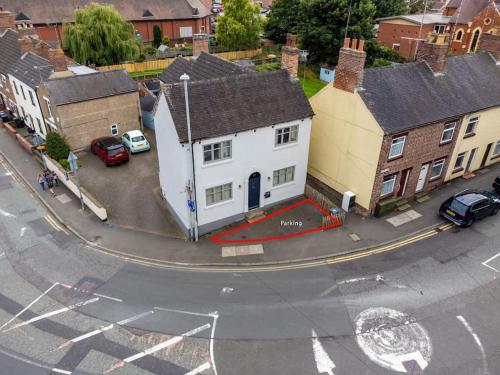 a model of a white house on a street at The Former New Inn, air conditioning in Ashby de la Zouch