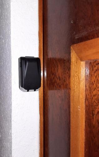 a close up of a door latch on a white wall at T2 Immeuble Chanteclerc 6 personnes 37m2 PRALOUP 1600 in Uvernet-Fours