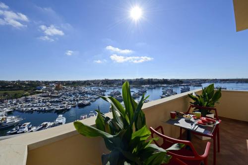 a balcony with a view of a marina at Best Western Hotel Martello in Lampedusa