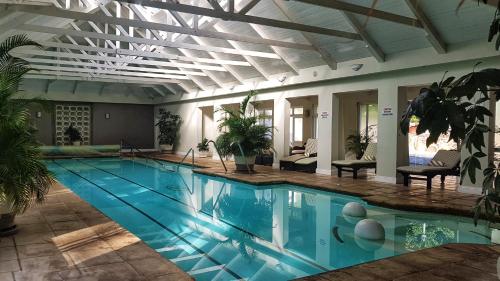 a large swimming pool with a large ceiling at Fordoun Hotel and Spa in Nottingham Road
