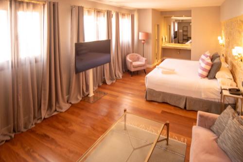 Postel nebo postele na pokoji v ubytování Hotel Don Juan Boutique