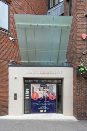 a store front of a brick building with a window at Chic Central Reading 1BR Apt CHRL F2 in Reading