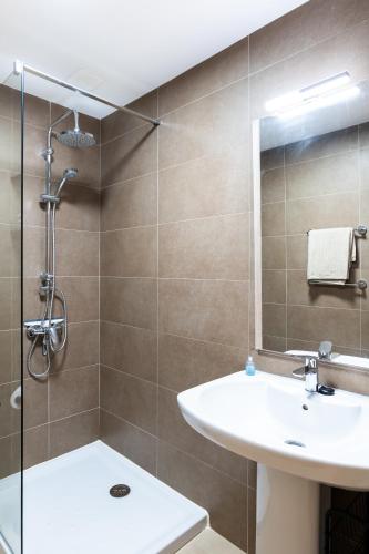 a bathroom with a sink and a shower at Casa Lilia in El Cotillo