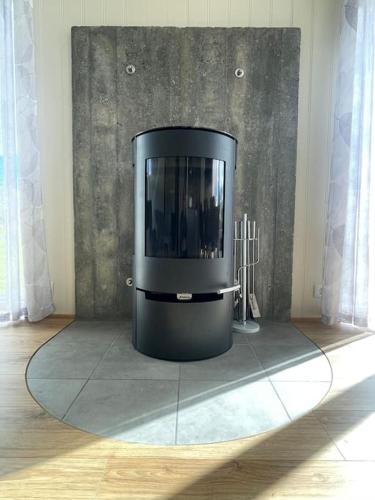 a black tv sitting on a floor in a room at Stunning house - amazing scenery in Hvolsvöllur