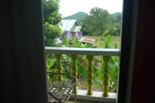 a view of a house from a window at ANZ LANGKAWI INN in Pantai Cenang