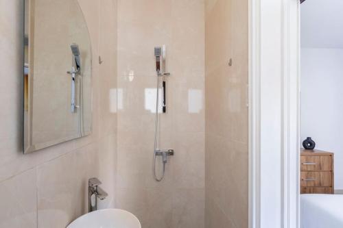 a bathroom with a shower with a toilet and a sink at Epicurian Residence in Nicosia