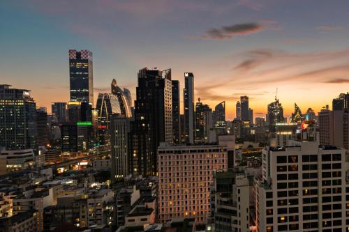 a view of a city skyline at night at The Echelon Sukhumvit 11 by LeFoyer in Bangkok