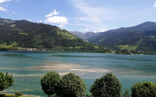 a view of a lake with mountains in the background at Haus Ditzer - Villa Theresia in Zell am See