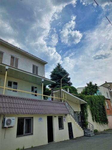 a white building with a balcony on the side of it at Large 5 bedroom VIP Villa 2 in Yerevan