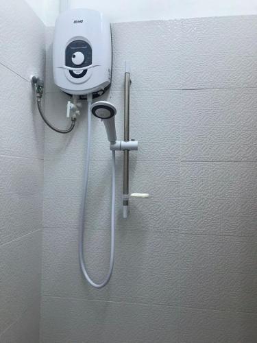 a shower in the corner of a bathroom at M1 Budget Comfortable Central in Kuching