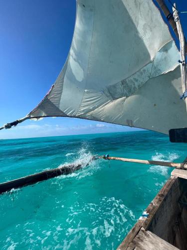 a view of the ocean from the bow of a boat at Stonefish Inn Jambiani in Jambiani