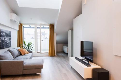 TV a/nebo společenská místnost v ubytování Penthouse Loft