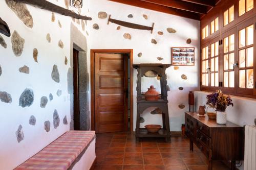 A bed or beds in a room at Casa Rural Tinamar