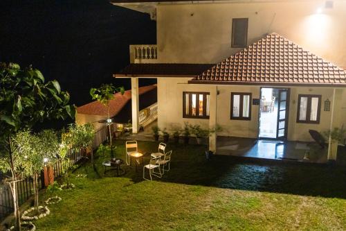 a small house at night with a yard at Villa by Mountain Homes- Lansdowne in Lansdowne