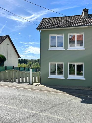 a house on the side of a street at Maison in Enquin-sur-Baillons