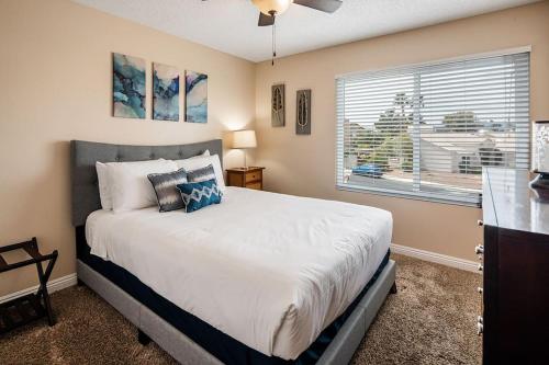 a bedroom with a large bed and a window at Vegas Getaway, Pool, Basket Ball, Games, Cook in Las Vegas