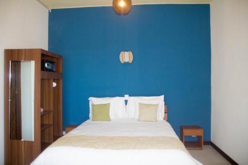 Ένα ή περισσότερα κρεβάτια σε δωμάτιο στο Ankoba Beach Hôtel