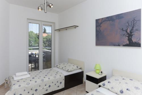En eller flere senger på et rom på Dubrovnik Summer Apartments