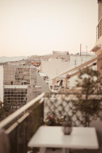 a view of a city from a balcony at Vanesa's House in Athens