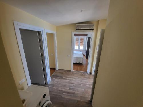 an empty room with a bathroom and a bedroom at Penthouse CASA ALKEA Masse Lake view in Brenzone sul Garda