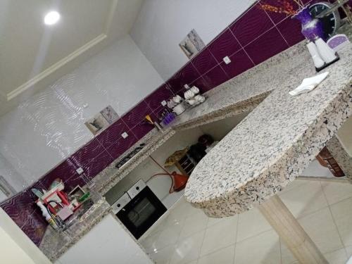 an overhead view of a kitchen with a granite sink at شقة فونتي العليا in Agadir