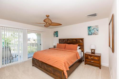 a bedroom with a bed and a ceiling fan at Ko Olina Kai New Villa Ohana in Kapolei