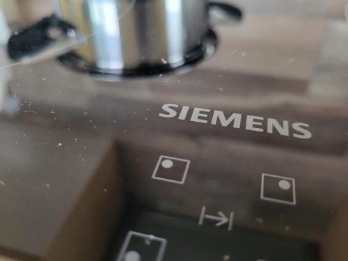 a close up of the words steemen on a kitchen appliance at Penthouse CASA ALKEA Masse Lake view in Brenzone sul Garda