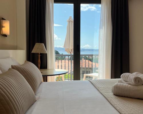 Ένα ή περισσότερα κρεβάτια σε δωμάτιο στο Casa en Sanxenxo con pisicina privada