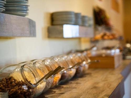 a row of wine glasses lined up on a counter at Hotel Garni Rosmari in Brenzone sul Garda