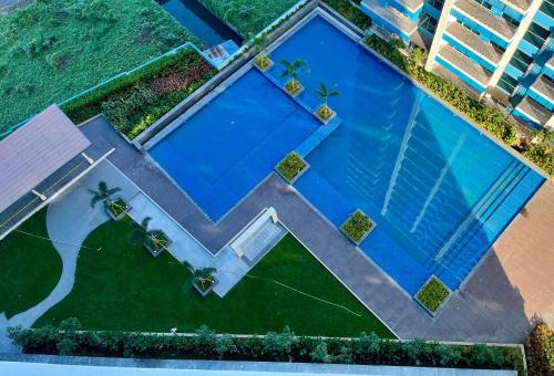 an overhead view of a large swimming pool at Residential Resort Condo by the Bay in Manila