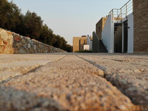 an empty road in front of a building at Riverstone Villas with private pools in Levktron
