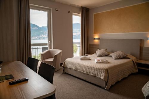 Postel nebo postele na pokoji v ubytování Hotel Garni Rosmari