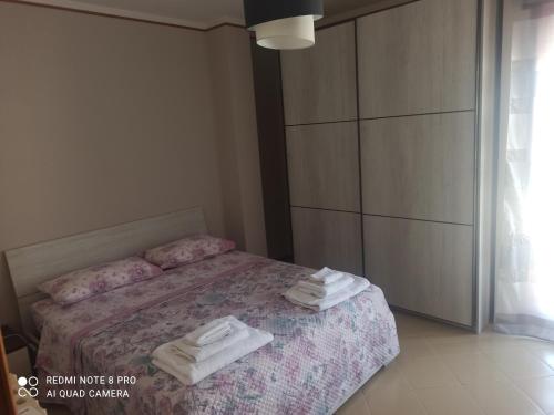 Ένα ή περισσότερα κρεβάτια σε δωμάτιο στο Villa Iris