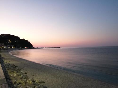 a view of the beach at sunset at Guest House Pafili in Zagora