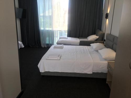 Postel nebo postele na pokoji v ubytování HOTEL SOBRANIE