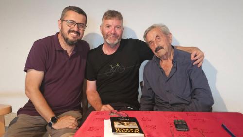 three men standing next to a table with a cake at Guesthouse Skadar Lake - Pavle in Virpazar