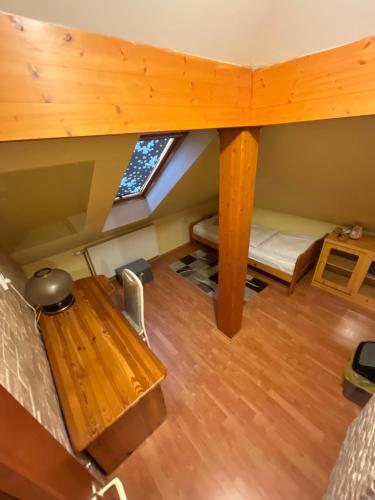 an overhead view of a dorm room with a bed and a desk at Orsi House in Szombathely