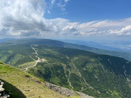 a view of a valley from the top of a mountain at U Gruszków - domek pod Chojnikiem in Jelenia Góra