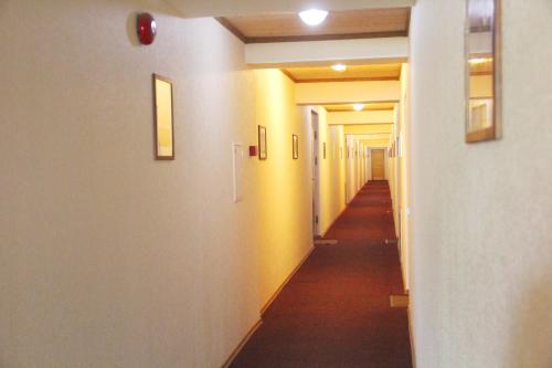 a hallway with yellow walls and a long corridor at Gabriel in Maardu