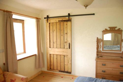 Ένα ή περισσότερα κρεβάτια σε δωμάτιο στο Stables,1 or 2 bedroom Eco earth house, edge of Dartmoor