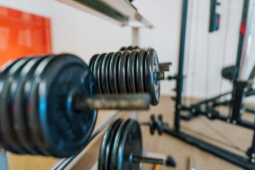 a group of dumbbells hanging on a wall at Ferienapartments Müller in Ebene Reichenau