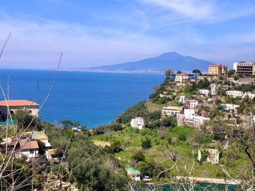 a town on a hill next to the ocean at Bilocale panoramico “Lo sguardo” in Massa Lubrense