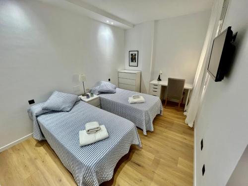 Postel nebo postele na pokoji v ubytování NEW CAPUCHINOS Apartment 2