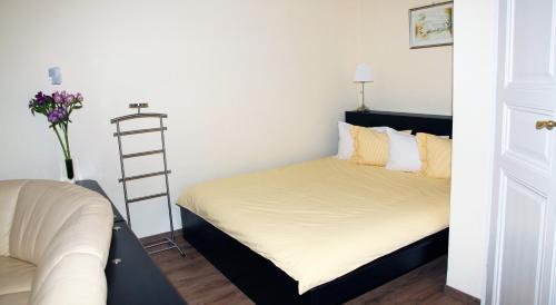 A bed or beds in a room at Classic Central Apartment